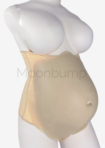 7-8 Month silicone large fake pregnant belly by Moonbump, in colour M4 'beige', shown on a mannequin